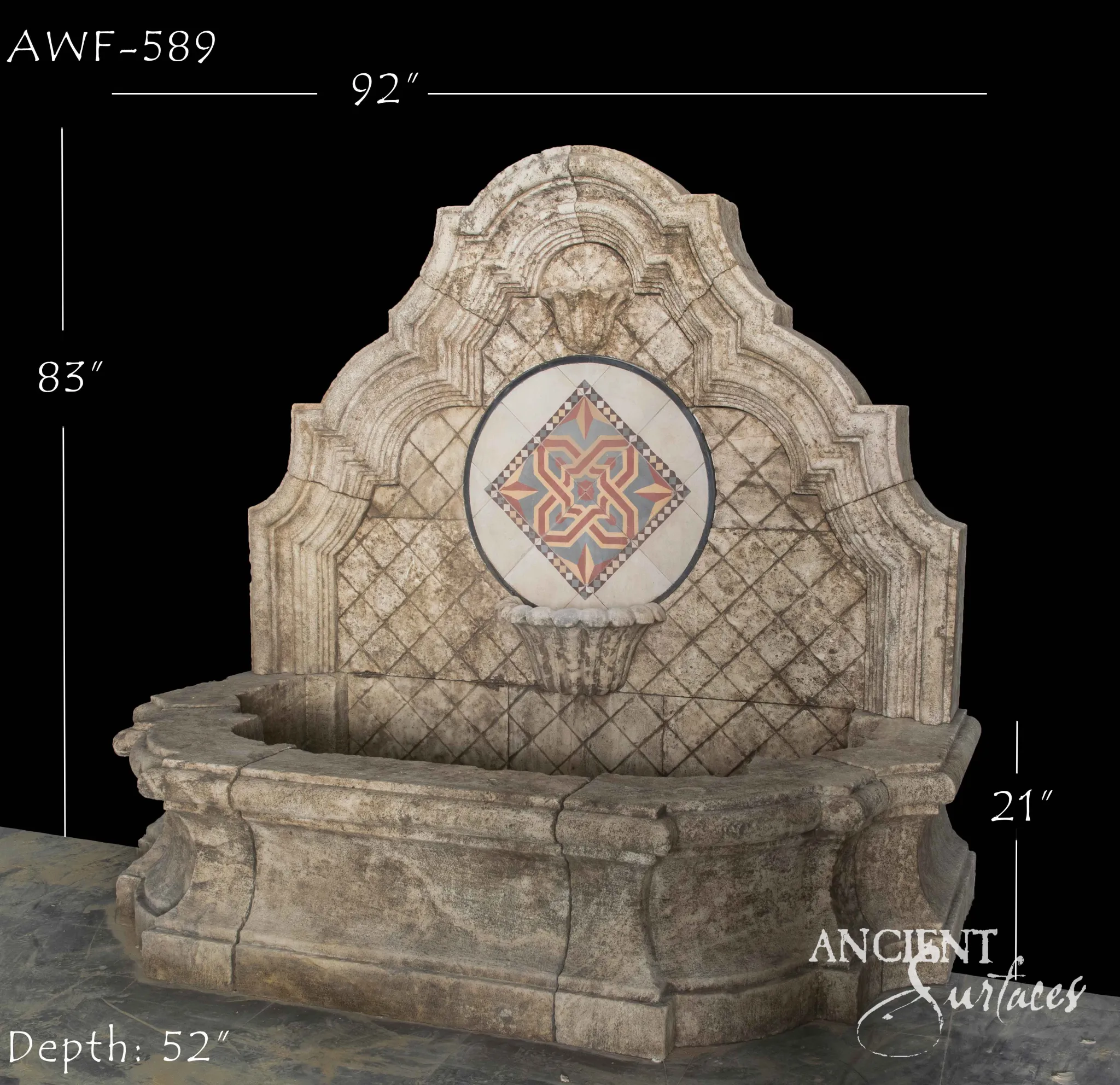 Ornate reclaimed limestone wall fountain with a scalloped backplate and colourful geometric tile mosaic medallion
