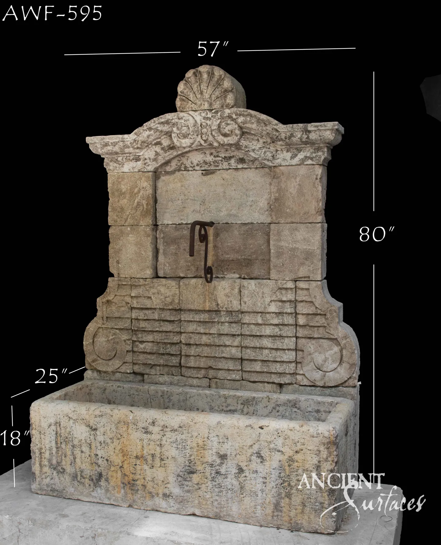 Monumental reclaimed limestone wall fountain with a scrolled Baroque pediment and scallop-shell finial over a large trough